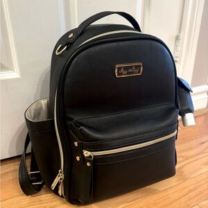 Itzy Ritzy mini, hand sanitizer holder, and packing cubes.